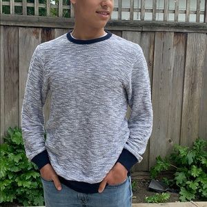 Loose fitting navy and white crew sweater.